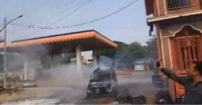 Car catches fire at petrol pump.