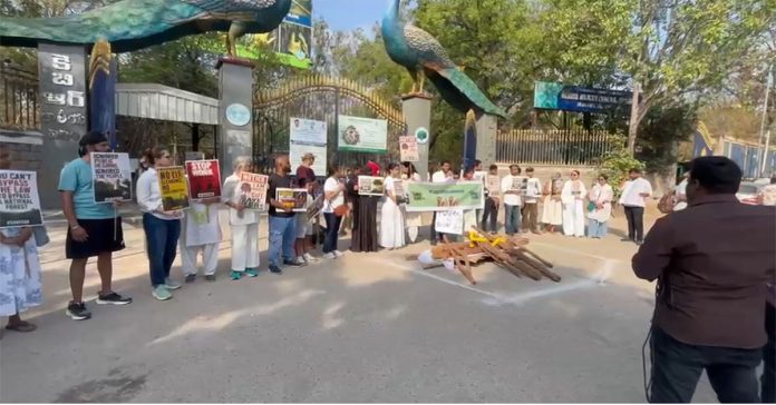 A group of citizens protest in front of KBR