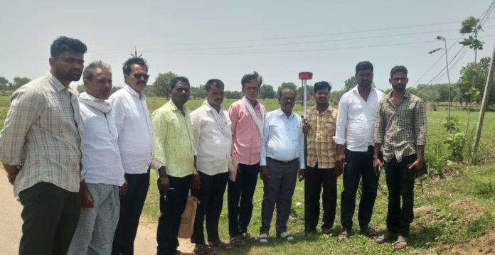 Land re-survey begins on the outskirts of Somuru village.